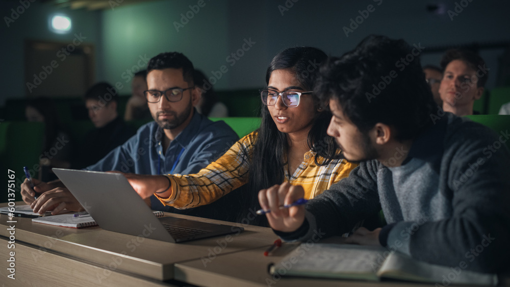 Poster group of multiethnic enthusiastic students collaborate in university classroom, compare research pro