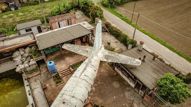 Aerial Close-up of Decaying Abandoned Airplane Tail