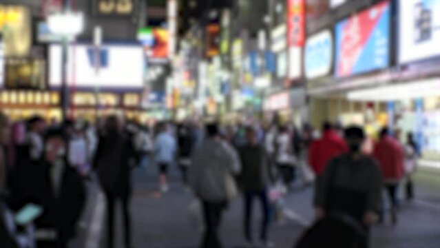 SHINJUKU, TOKYO, JAPAN - APRIL 2023 : KABUKICHO, TOYOKO area at night. TOYOKO KIDS (Group of young people, living around Kabukicho after been kicked out or driven from their homes) at the street.