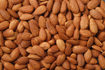Pattern Organic almond nut raw peeled as background, top view. Healthy snack or for vegetarians. copy space banner.