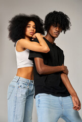 Portrait of young african american couple wear summer outfit isolated on gray background