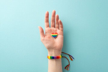 Honor LGBTQ History Month with this first person top view photo of a female hand wearing a...