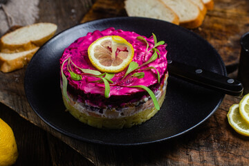 Salad with beets and salmon in a bowl. Salad Shuba