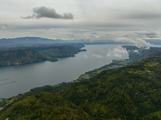 Aerial drone of Samosir Island and Lake Toba in Sumatra. Tropical landscape. Indonesia.