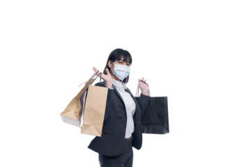 Woman in work clothes holding shopping bags.