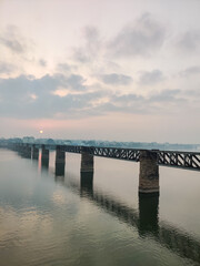 Fototapeta na wymiar Railway bridge on the river godavari in rajahmundry, India. Also called Godavari Bridge.