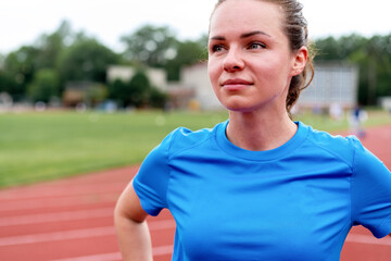 Portrait young female athlete after run.