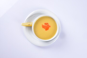 Lentil Soup with lemon and hot oil sauce, in white bowl