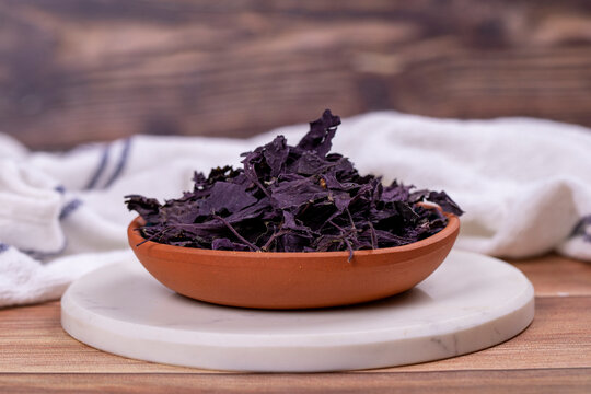 Red basil. Spices concept. Dried red basil spice on wood background. Local name reyhan