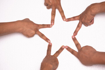 Diverse people hands forming star shape with their fingers.Together processing hands connecting to...