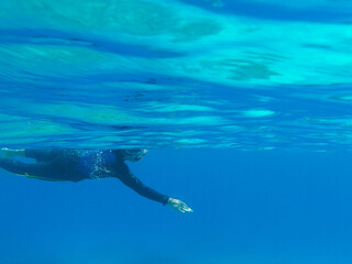 UNDERWATER. Scuba diver in the waters of the ANTIPAXOS island, Greece.