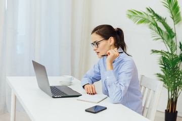 woman with laptop conversation online via internet remote work