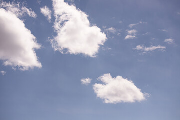 White clouds in the blue sky.