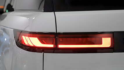 Rear red light of a new white car, led technology