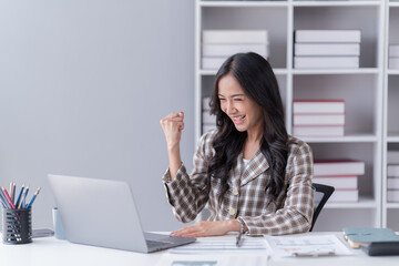 businesswoman working at the office use smart phone and notebook for make deal. 