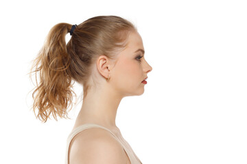 Profile, side view of beautiful serious blonde woman with tied hait on a white background