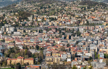 Fototapeta na wymiar Top view of the Lugano city, Ticino, Switzerland. Architectural background.