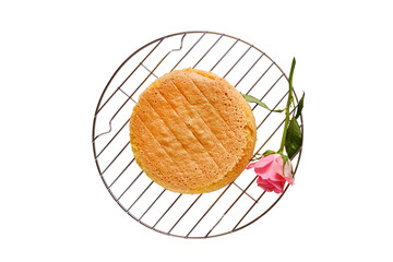 Fresh baked cake biscuit, isolated on a white background. Red flower and metal shape, top view