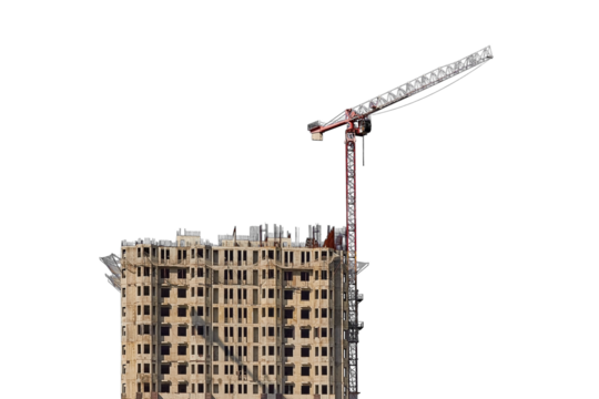 Under construction building against the sky and tower cranes, isolated on a white background. Unfinished construction house
