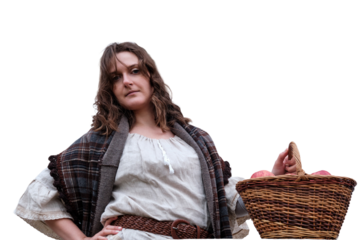 A woman is standing with a wicker basket full of red apples, isolated on a white background.