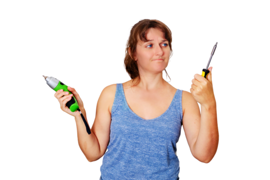 A woman chooses between an electric and a mechanical screwdriver, isolated on a white background. Repair in a new apartment on their own.
