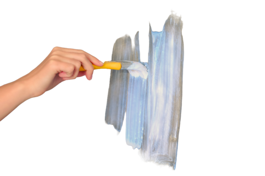 A woman's hand paints the wall with white paint, isolated on a white background. Yellow brush apply paint on the walls when repairing the house.