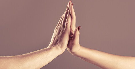 Two hands, male and female. High five concept for success, teamwork, congratulating, celebration....