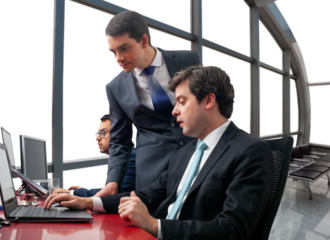 executives analyzing business on computer