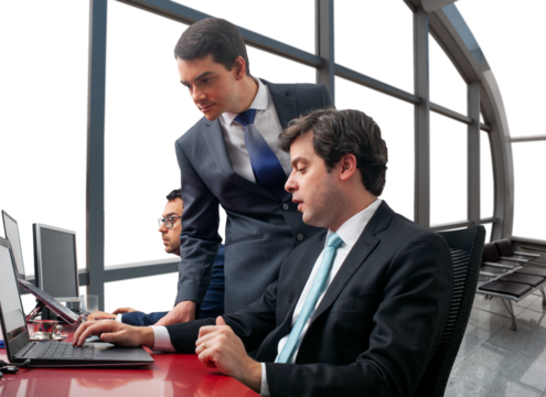 executives analyzing business on computer