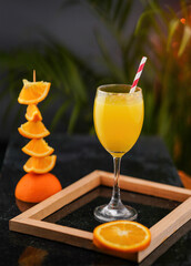 Fresh orange juice with sliced orange fruits, fresh and healthy juice with wooden frame, Juice photography