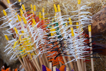 Traditional colorful Wooden Arrows vertically gathered together in a bowl. Colorful traditional...