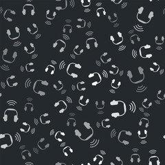 Grey Smart headphones system icon isolated seamless pattern on black background. Internet of things concept with wireless connection. Vector