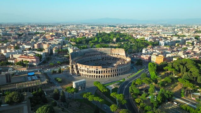 Top view of the Colosseum and Palatine Hill, Historical landmarks in Rome, Italy. Aerial view of the sunrise over the old ancient Italian top destination and country symbol Colosseum in ProRes 4K.