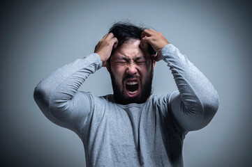 Asian handsome man angry on white background,Portrait of young Stress male concept