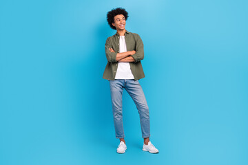 Full body photo of young model handsome guy crossed hands confident wear khaki shirt jeans look...