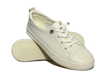White unisex sneakers with white laces. Modern comfortable shoes.