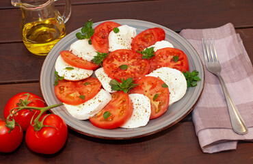 Tomato and mozzarella Caprese salad with sauce 