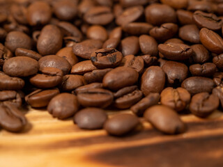 Background from roasted coffee beans. Scattered coffee beans.