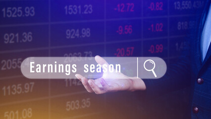 Earnings season, hand holding with written in search bar with the financial data visible on background, Reports Stock Market Ticker