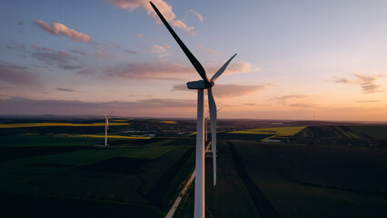 Wind turbines or windmill help to obtain ecological and efficient electricity.Green energy is ...