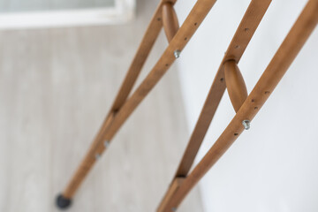 Crutches. Fractured legs. Crutches as a sign of disability. Symbol of disability. Rehabilitation in case of injury. Concept - workplace injury. Life with disabilities. Personal injury. Injuries.