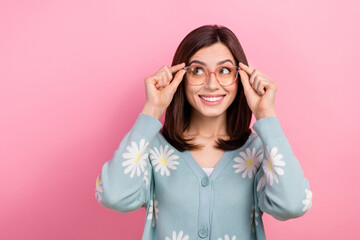 Photo of shiny tricky lady wear turquoise clothes arms spectacles looking empty space isolated pink color background