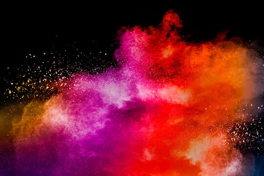 Colored powder explosion. Abstract closeup dust on backdrop. Colorful explode. Paint holi. © Cami