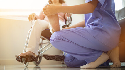 Physical therapists are helping elderly people to take care of themselves after a long period of recovery and they need regular physical therapy to help their bodies recover. physical therapy concept