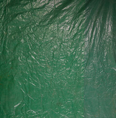 green abstract crumpled old tarpaulin background