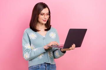 Photo of young attractive student girl preparing her last exam using her new acer laptop wear...