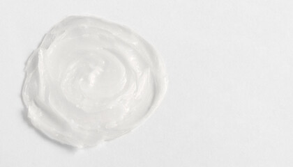 The texture of the lip balm. Transparent ointment on a white background and copy space
