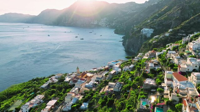 Scenic sunset over Praiano Town on the Amalfi Coast with Mediterranean Sea views. Beautiful drone view of the Italian prime tourist location between the towns of Amalfi and Positano in ProRes 4K