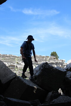 hiker in the mountains in the ruins