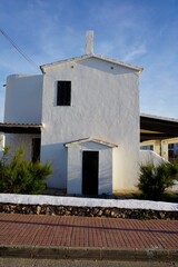 Little white house in a village in Menorca